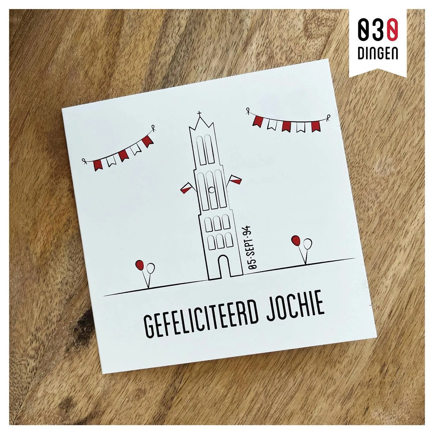Verjaardagskaart met de Domtoren, slingers en de tekst "Gefeliciteerd jochie"